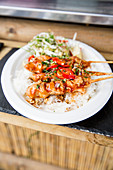 Satay skewers with chili sauce and rice