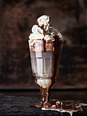 Dark and white chocolate with cream in a glass