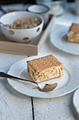 Biscuit slices with shortbread, cream and almonds