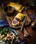 Venison Wellingtons with rosemary and redcurrant sauce