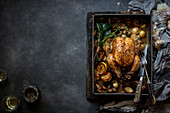 Roast chicken with baby potatoes and portabellinis