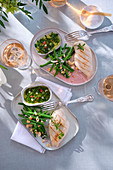 Steamed chicken breast with green beans, chimichurri and cashew nuts