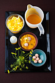 Pumpkin and coconut soup with shrimp dumplings and fennel flowers