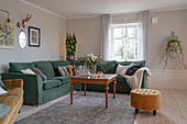 Green corner sofa in classic living room in winter