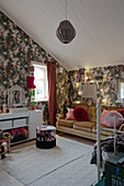 Old sofa and floral wallpaper in vintage-style teenager's bedroom