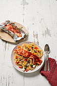 Oven salmon on spaghetti with vegetables