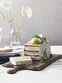 Savoury sandwich cake with radishes and herbs