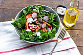 Herb salad with radishes, tomatoes and carrots