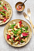 Pasta salad with asparagus, sheep's cheese and an onion and bacon vinaigrette