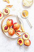 Fresh nectarines on a white plate
