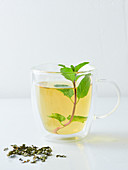 Mint tea, fresh mint and dried tea leaves