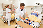 Nurse fitting pressure relief boots on a patient