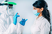 Medical worker taking swab for a coronavirus test