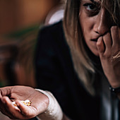 Woman with mental health problems with antidepressant pills