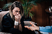 Depressed woman in psychotherapy session