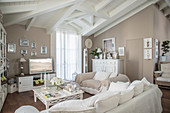 Upholstered furniture in living room decorated in white and beige