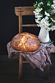 Homemade sweet Easter bread on a rustic chair