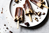 Peanut butter and chocolate fudge popsicles.