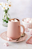 Hot chocolate with pink and white marshmallows.