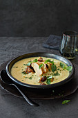Curry coconut soup with chicken breast strips