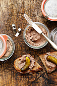 Homemade pâté in jars and on bread