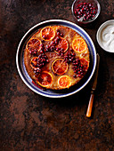 Upside down cake with blood oranges and pomegranate seeds