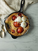 Clafoutis with plums and vanilla ice cream