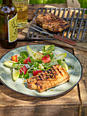 Pork chops in apple marinade with salad