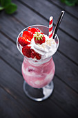 Vegan strawberry ice cream shake with soy cream and fresh berries