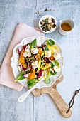 Colourful chicory salad with oranges and feta cheese