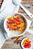 Porridge with citrus fruit, honey and almond milk