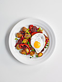 Fried egg with red pepper hash