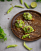 Toasted bread slices with pea pesto