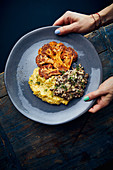 Vegan cauliflower steak with mashed potatoes and hummus lentils