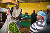 Weighing tea harvest, Kenya