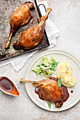 Grilled goose legs with savoy cabbage and mashed potatoes and apples