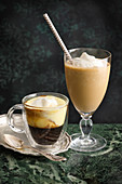 Kaisermelange (Austrian coffee speciality made with mocha, egg yolk, sugar and Cognac) and a stirred Viennese iced coffee
