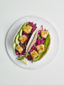 Fish tacos with red and cabbage slaw