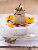 Plum parfait with punch sauce and mandarins