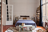 Double bed and bookcase in bedroom