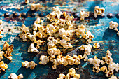 Popcorn on a blue surface