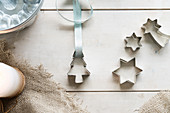 Cutters, a ribbon and a baking tin