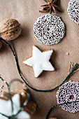 Christmas biscuits, a walnut and star anise on brown paper