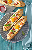 Boat shaped baguettes with tomatoes and eggs
