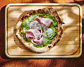 Pizza with mortadella and pistachio cream