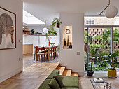 Open-plan, split-level interior with access to small courtyard garden