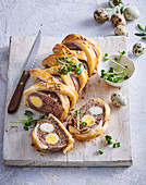 Meat strudel with quail eggs and nettles