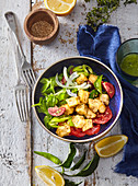 Fried halloumi cheese with vegetable salad