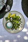 Herbal salad with salt and limes