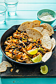 Mexican pulled chicken with peppers, black beans, mexican spices and tortilla chip